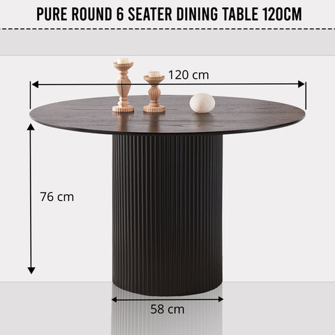 Black round dining table 6 seater UK styled with dining chairs and place settings