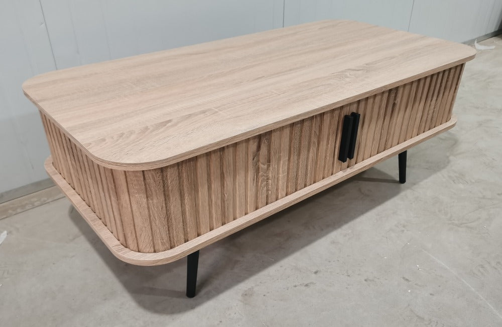 Close up of slatted sliding doors on oak effect coffee table with storage